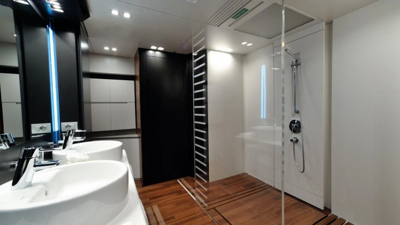 a bathroom with a shower unit and sink aboard QUASAR Yacht for Sale