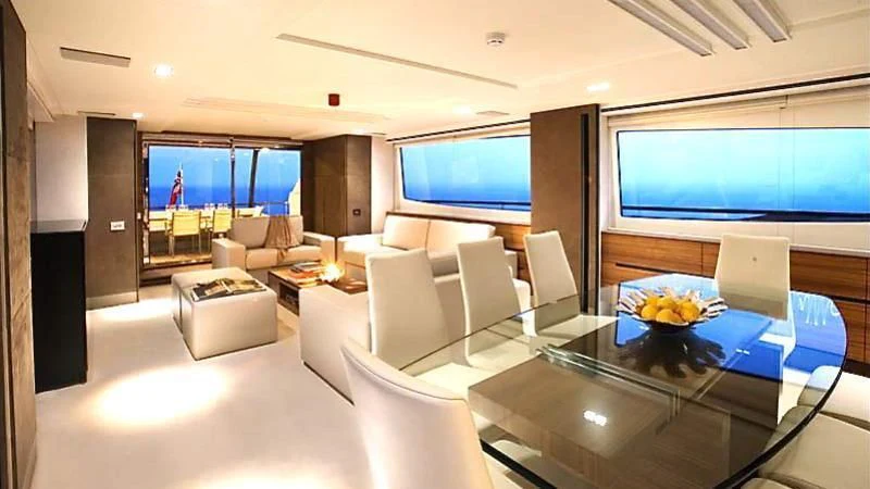 a room with a table and chairs aboard QUASAR Yacht for Sale