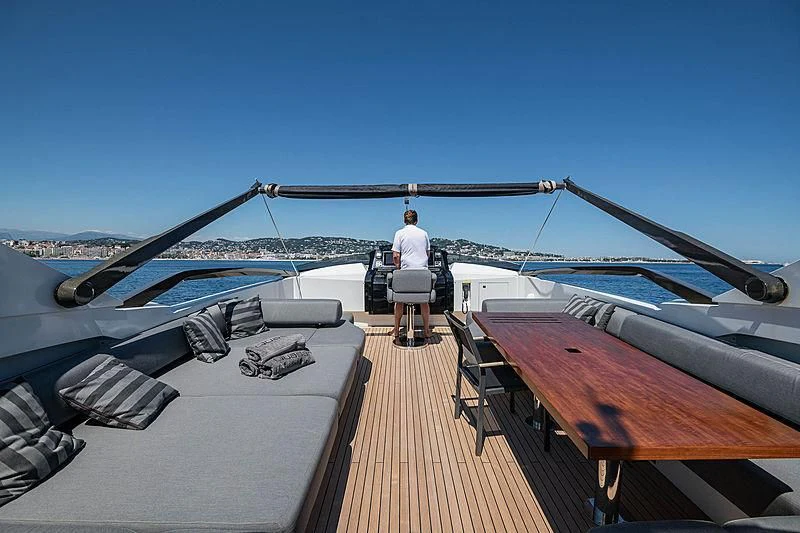 a person standing on a boat aboard QUASAR Yacht for Sale