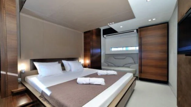 a bed in a room aboard QUASAR Yacht for Sale
