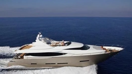 a white yacht on the water aboard QUASAR Yacht for Sale