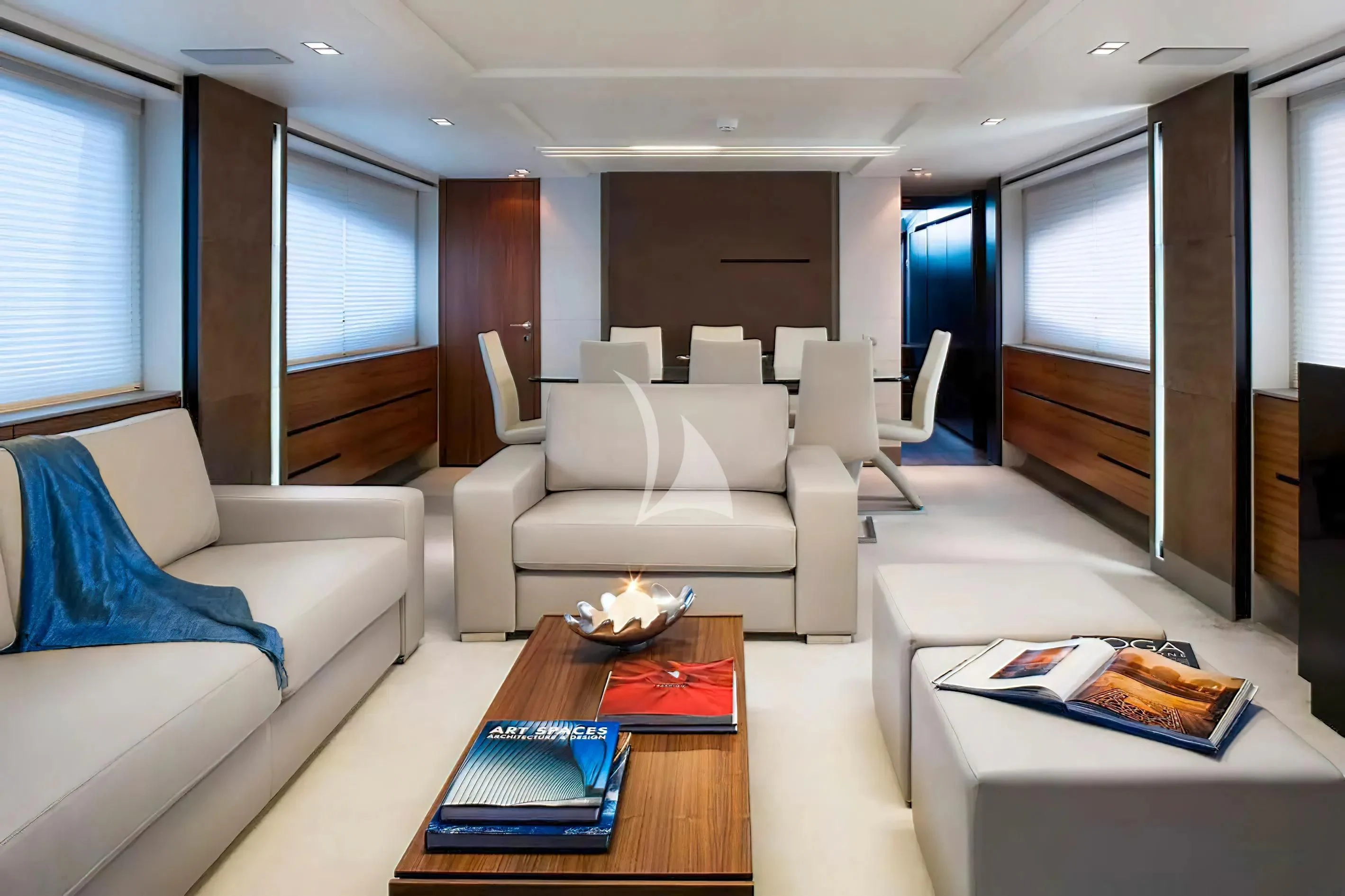 a living room with white couches aboard QUASAR Yacht for Sale