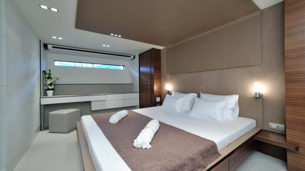 a bed in a room aboard QUASAR Yacht for Sale