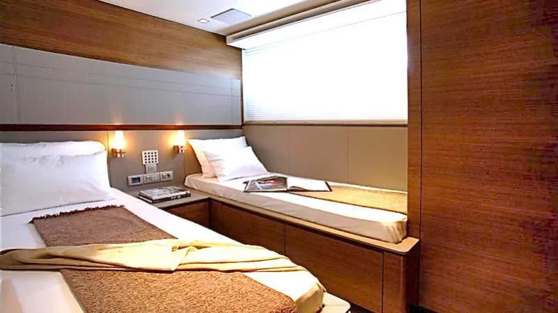 a couple of beds in a room aboard QUASAR Yacht for Sale