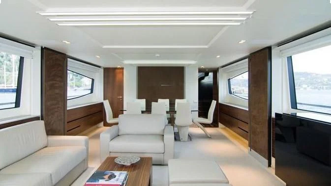 a living room with a wood floor aboard QUASAR Yacht for Sale