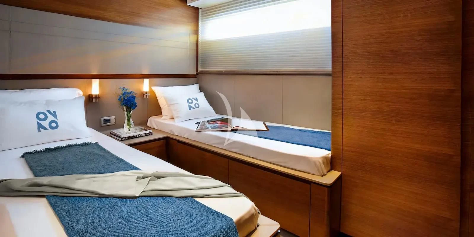 a couple of beds in a room aboard QUASAR Yacht for Sale