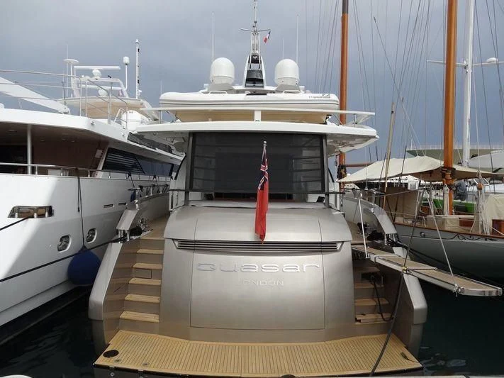 a boat is parked in a harbor aboard QUASAR Yacht for Sale