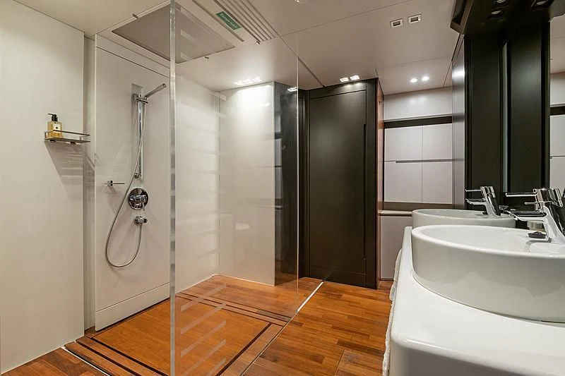 a bathroom with a shower and sink aboard QUASAR Yacht for Sale