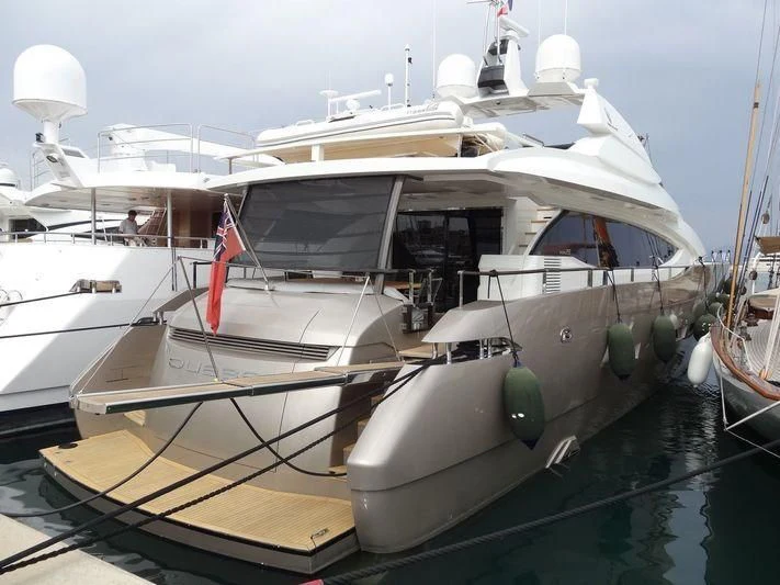 a boat docked in a harbor aboard QUASAR Yacht for Sale