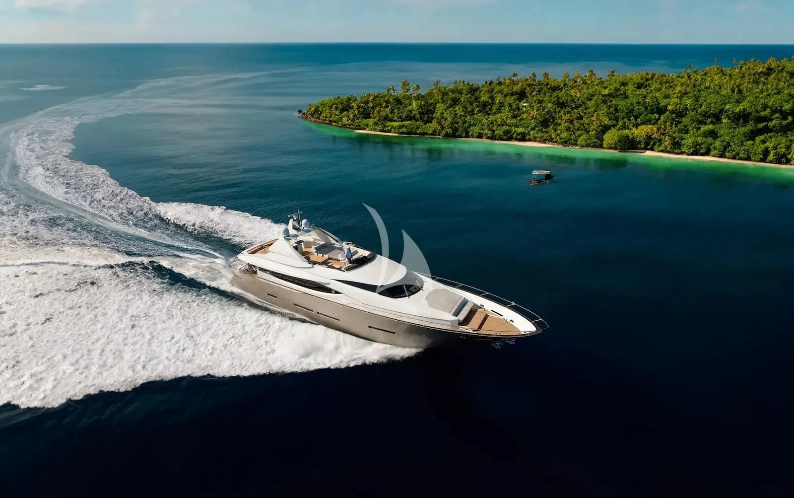 a white boat on the water aboard QUASAR Yacht for Sale