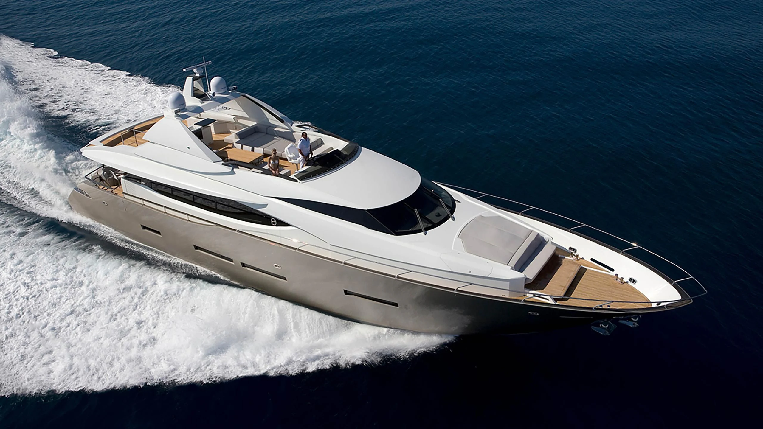 a white boat on the water aboard QUASAR Yacht for Sale