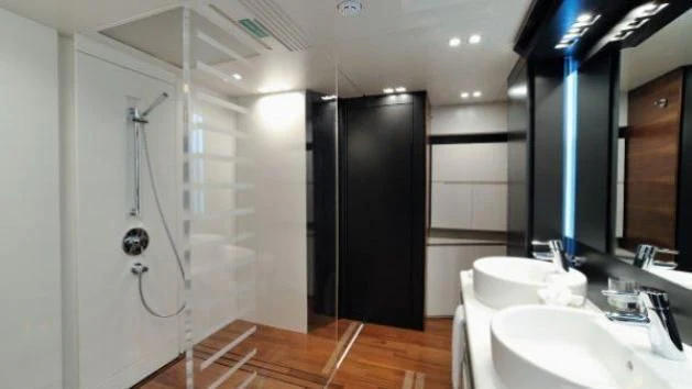 a bathroom with a sink and a shower aboard QUASAR Yacht for Sale