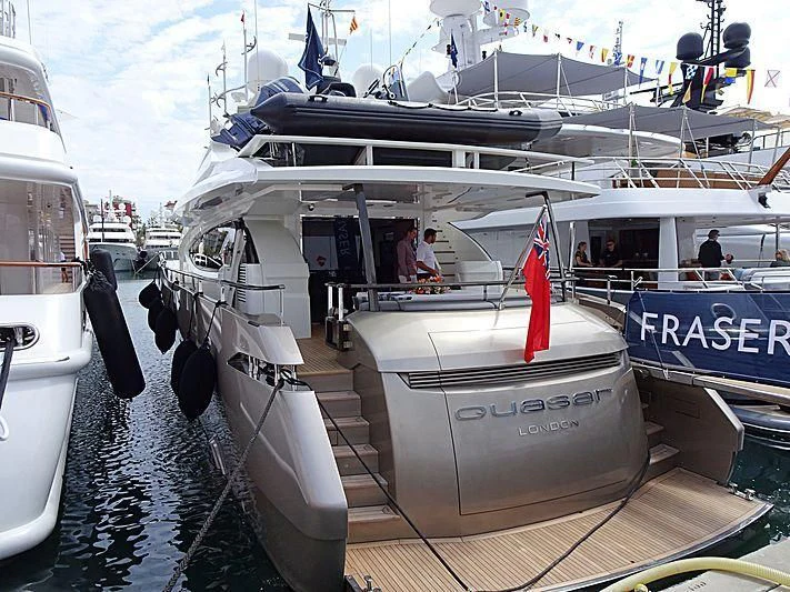 a boat docked at a pier aboard QUASAR Yacht for Sale