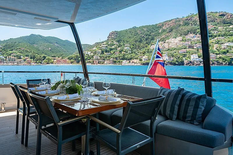 a table set for a meal on a boat aboard QUASAR Yacht for Sale