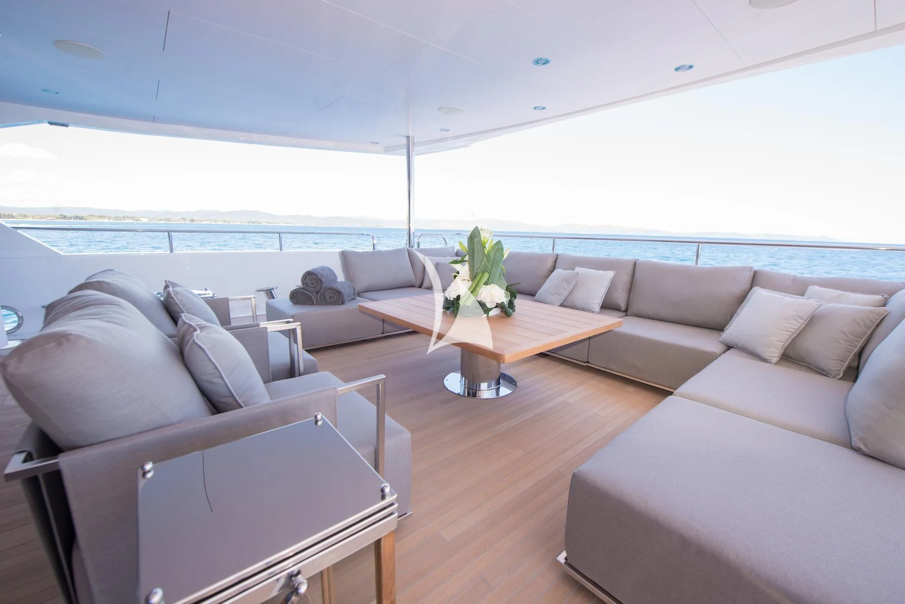 a living room with a couch and a table aboard E-MOTION Yacht for Sale
