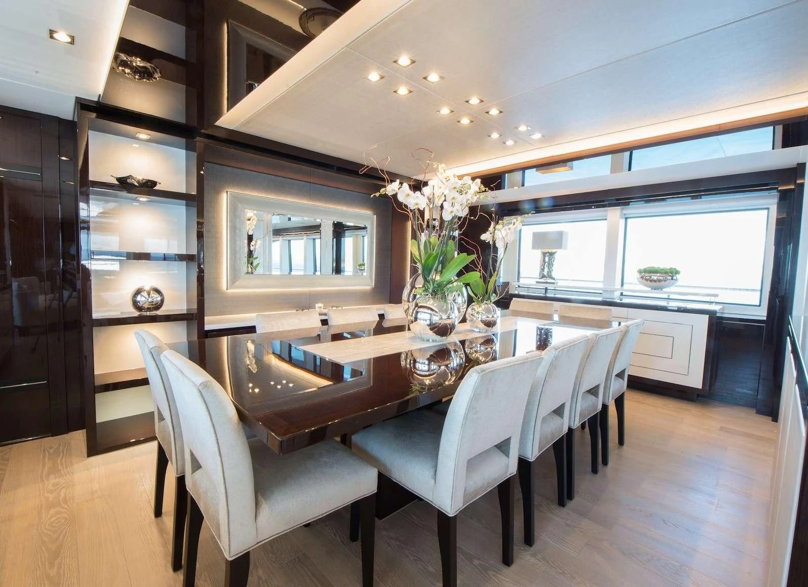 a kitchen with a table and chairs aboard E-MOTION Yacht for Sale
