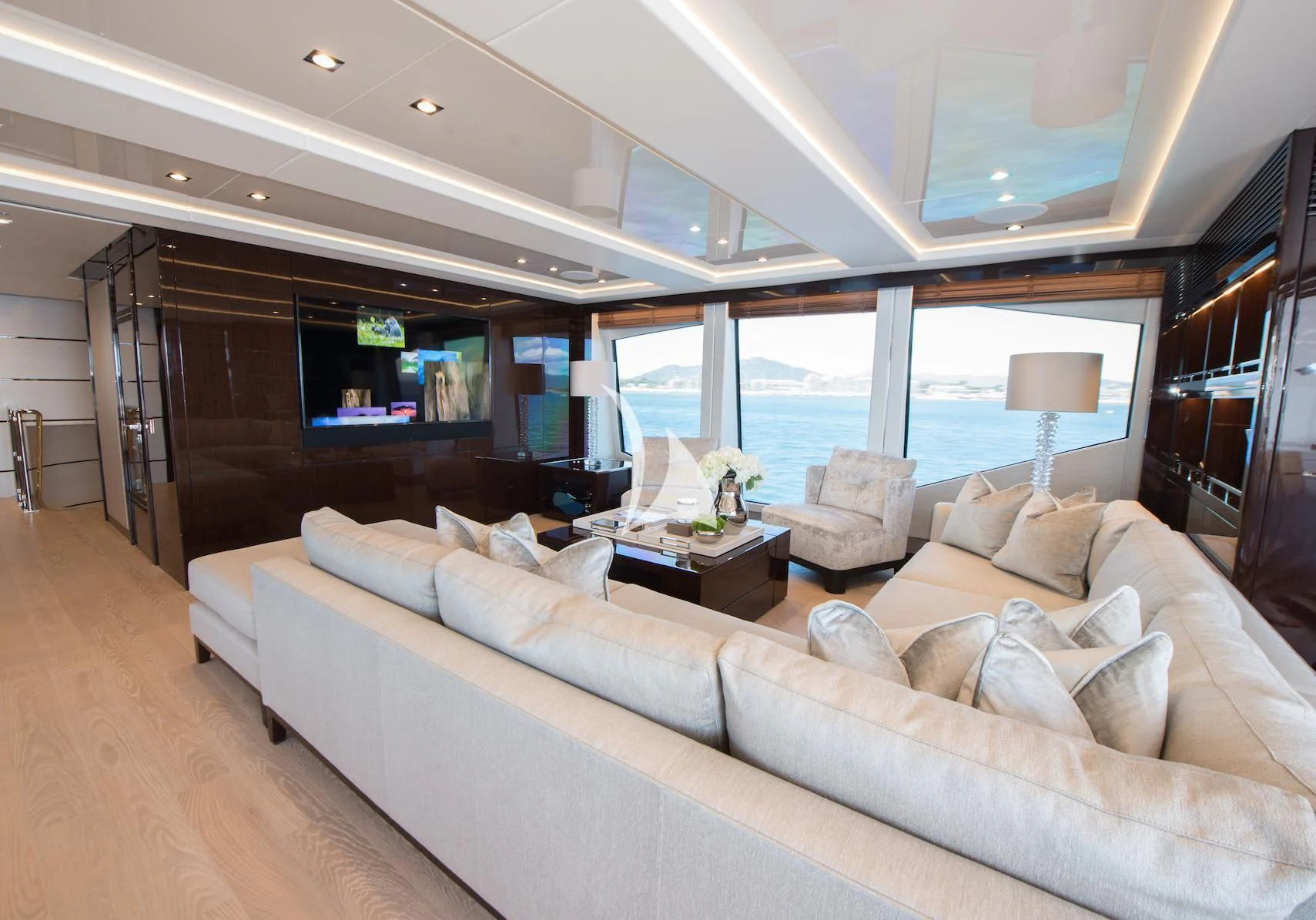 a living room with a large window aboard E-MOTION Yacht for Sale