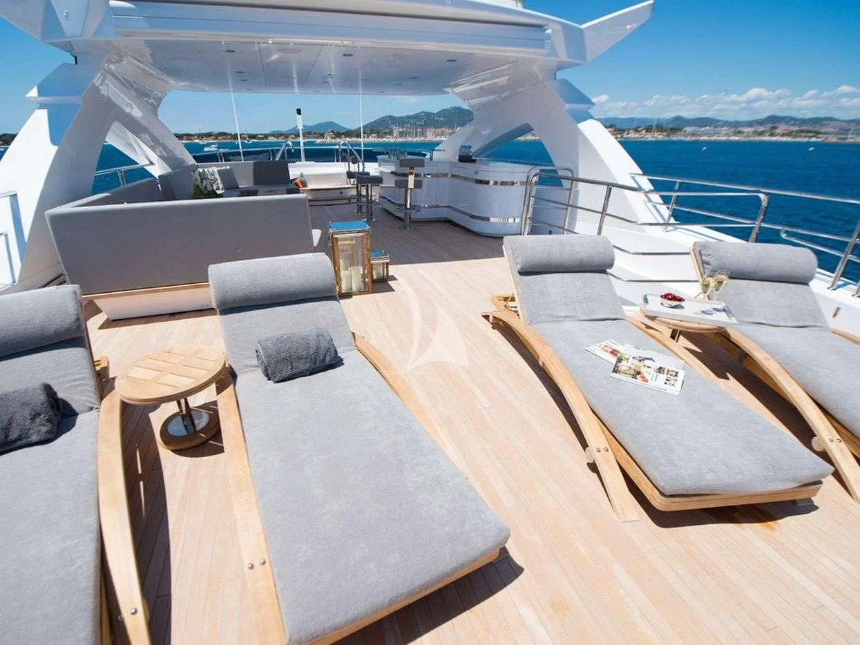 a room with a couch and a table and a pool aboard E-MOTION Yacht for Sale