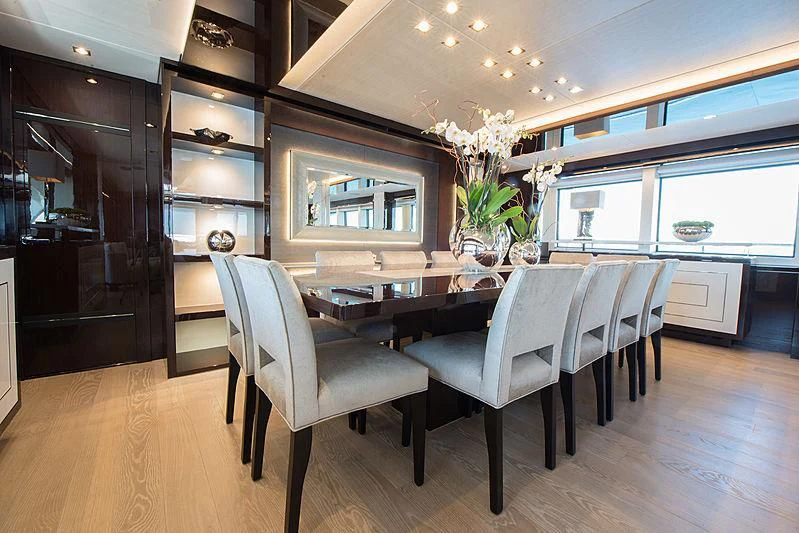 a dining room with a table and chairs aboard E-MOTION Yacht for Sale
