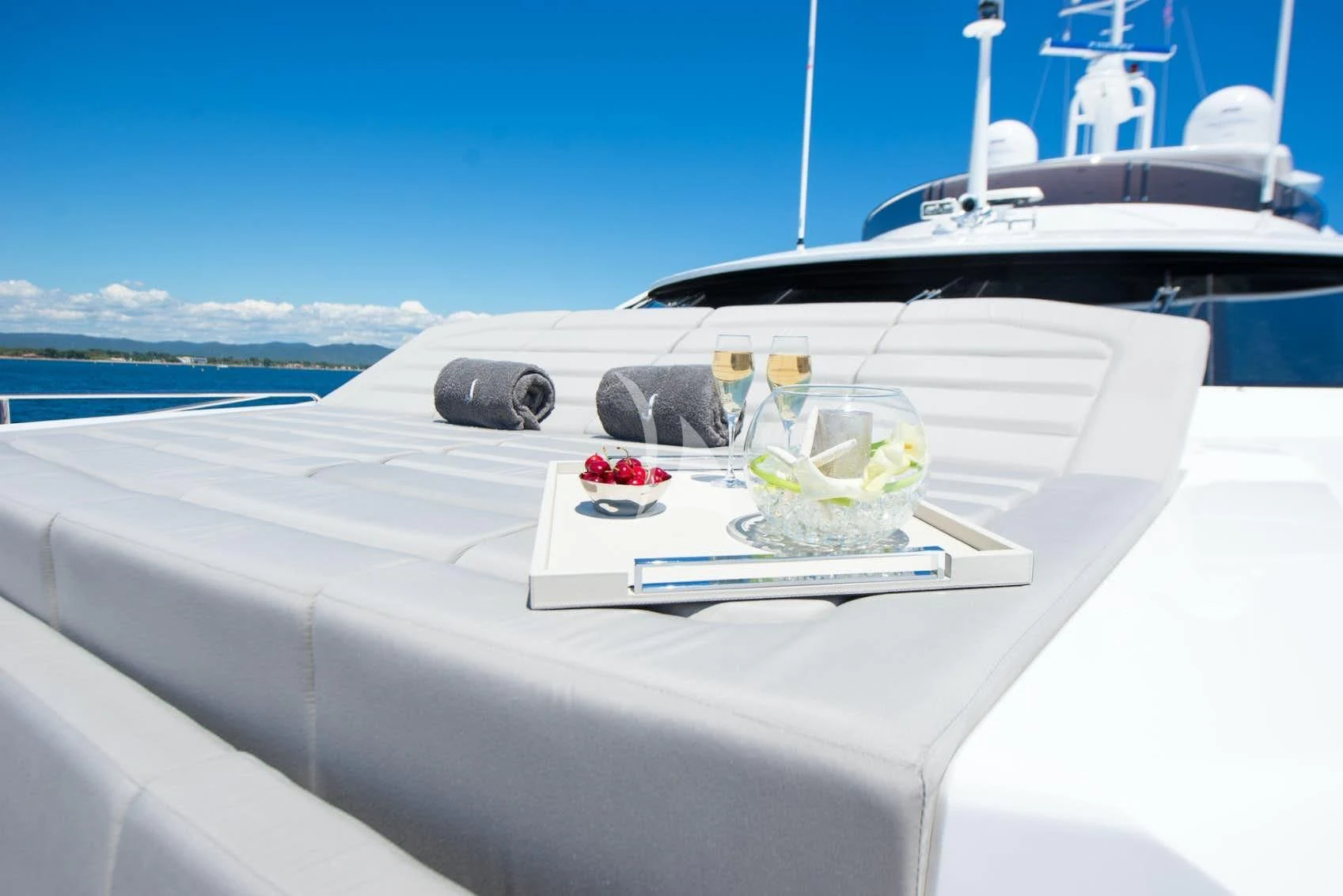 a white table with drinks on it aboard E-MOTION Yacht for Sale