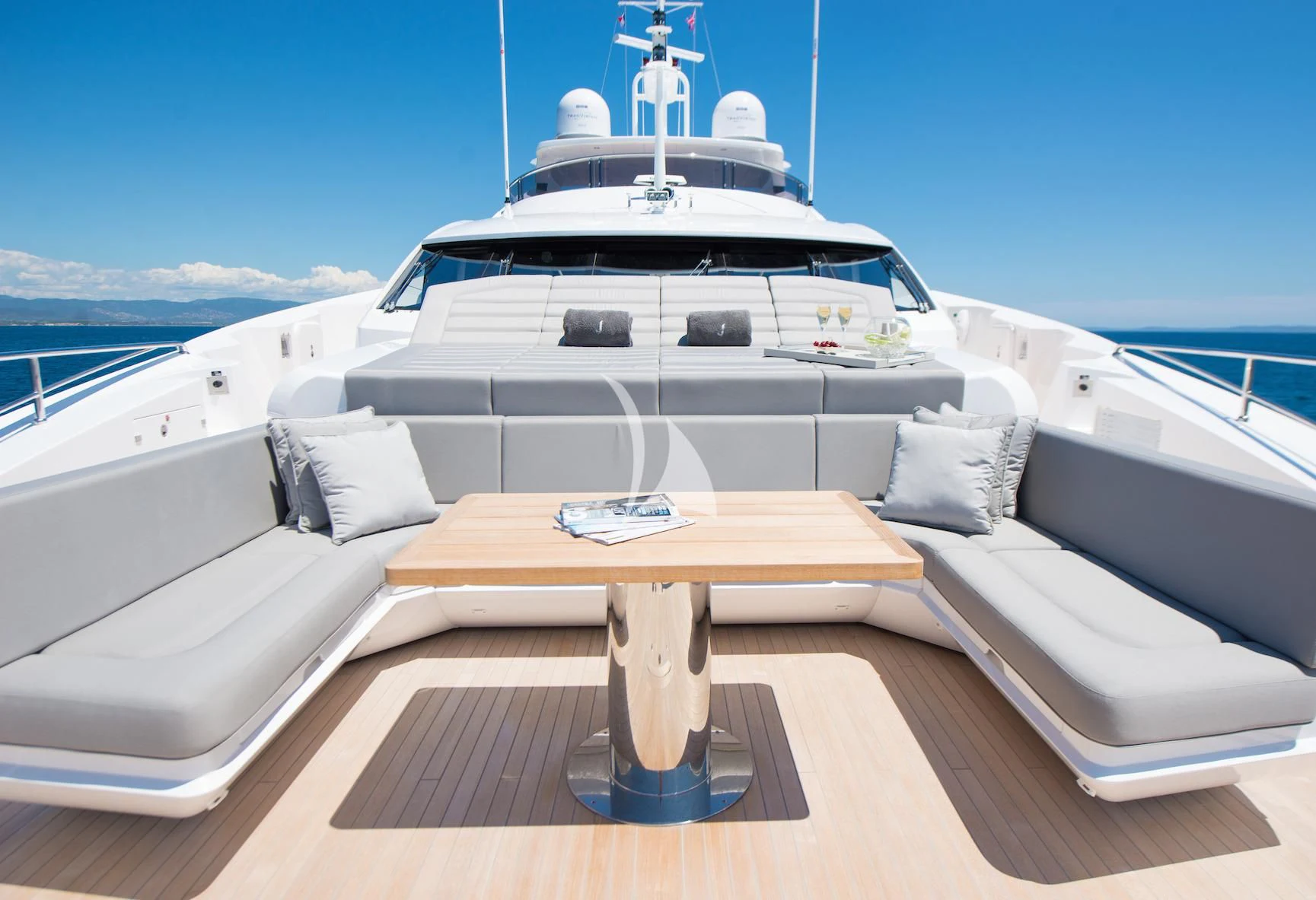 a white yacht on a deck aboard E-MOTION Yacht for Sale