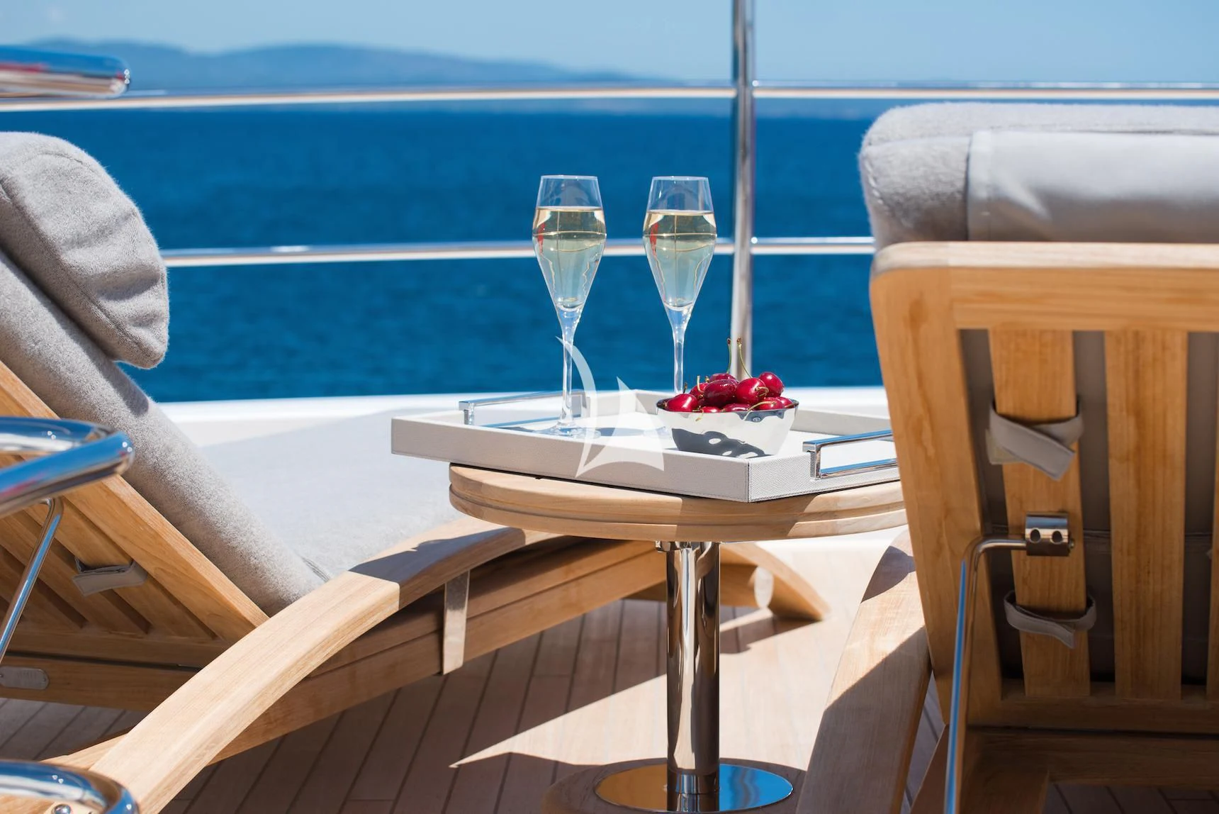 a table with wine glasses and fruit on it aboard E-MOTION Yacht for Sale