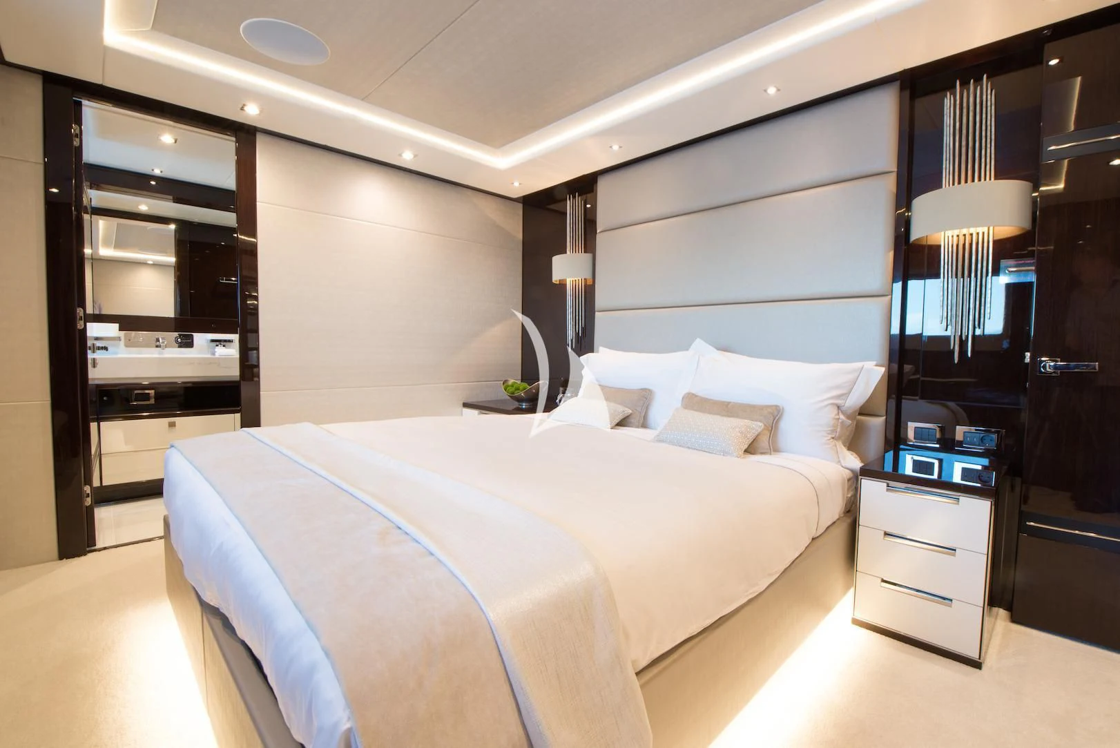 a bedroom with a bed and a desk aboard E-MOTION Yacht for Sale