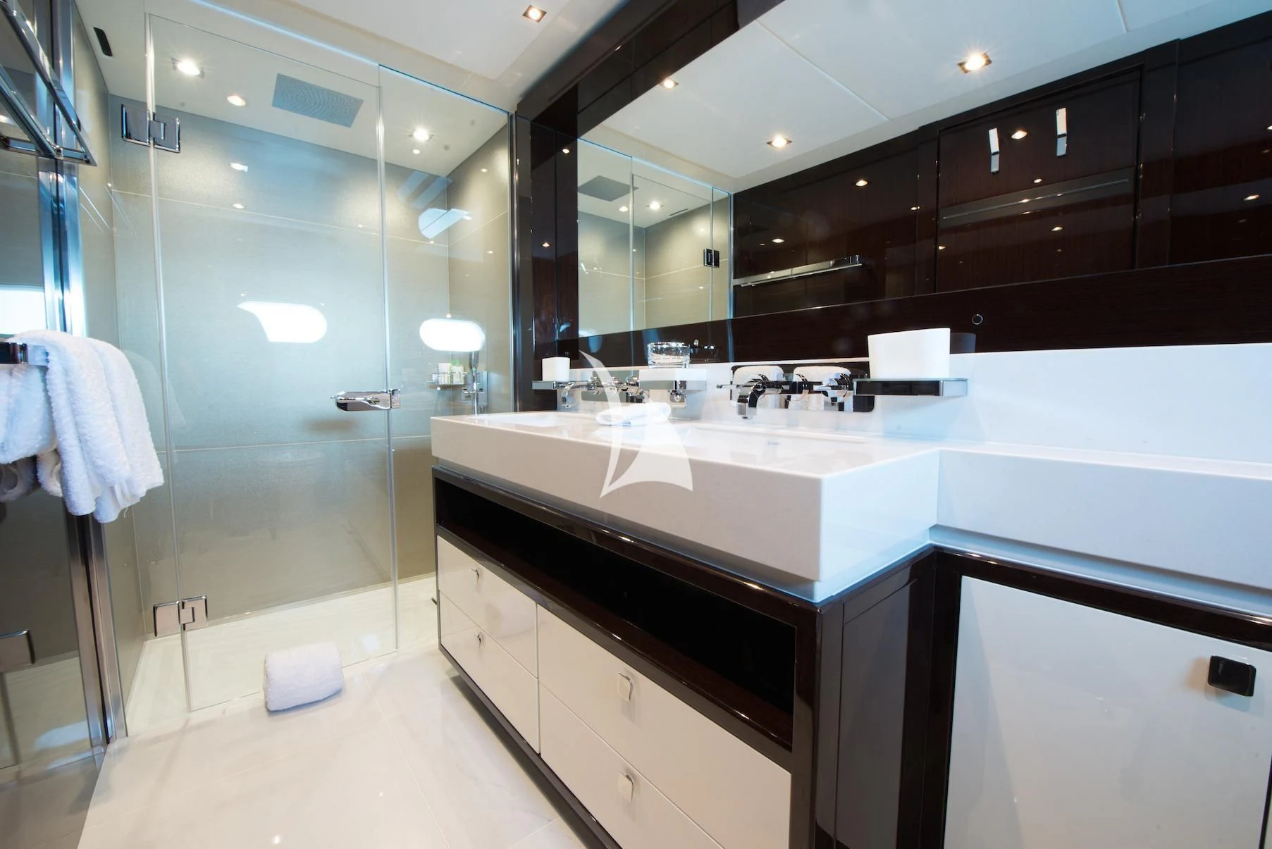 a bathroom with a glass shower aboard E-MOTION Yacht for Sale