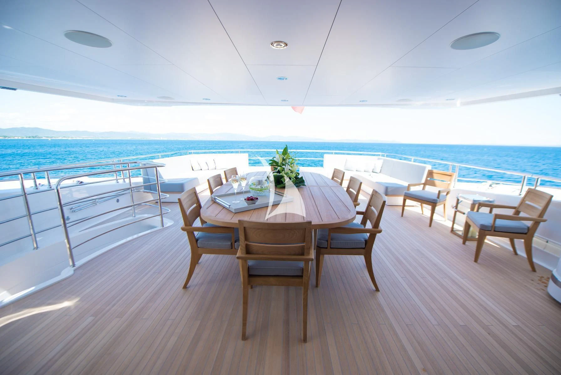 a table and chairs on a deck aboard E-MOTION Yacht for Sale