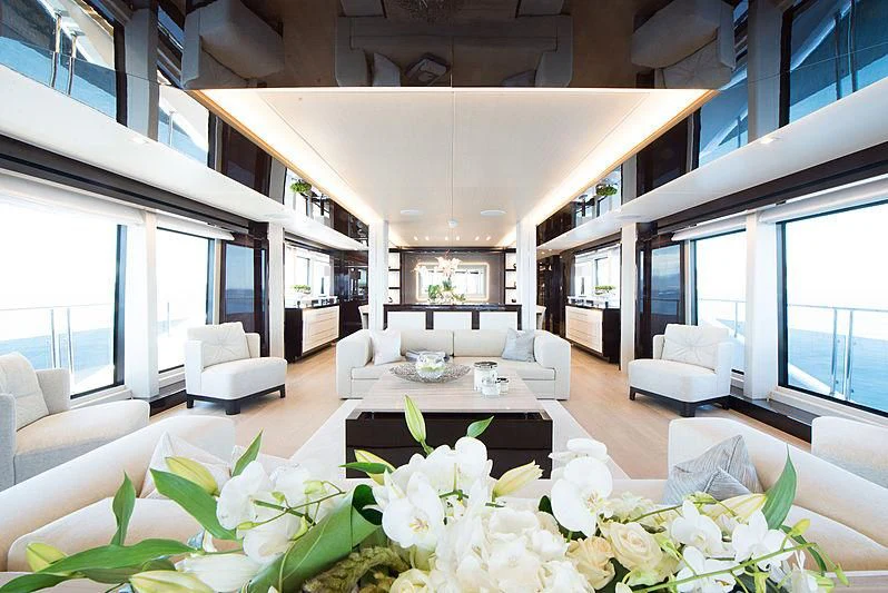 a living room with white furniture aboard E-MOTION Yacht for Sale