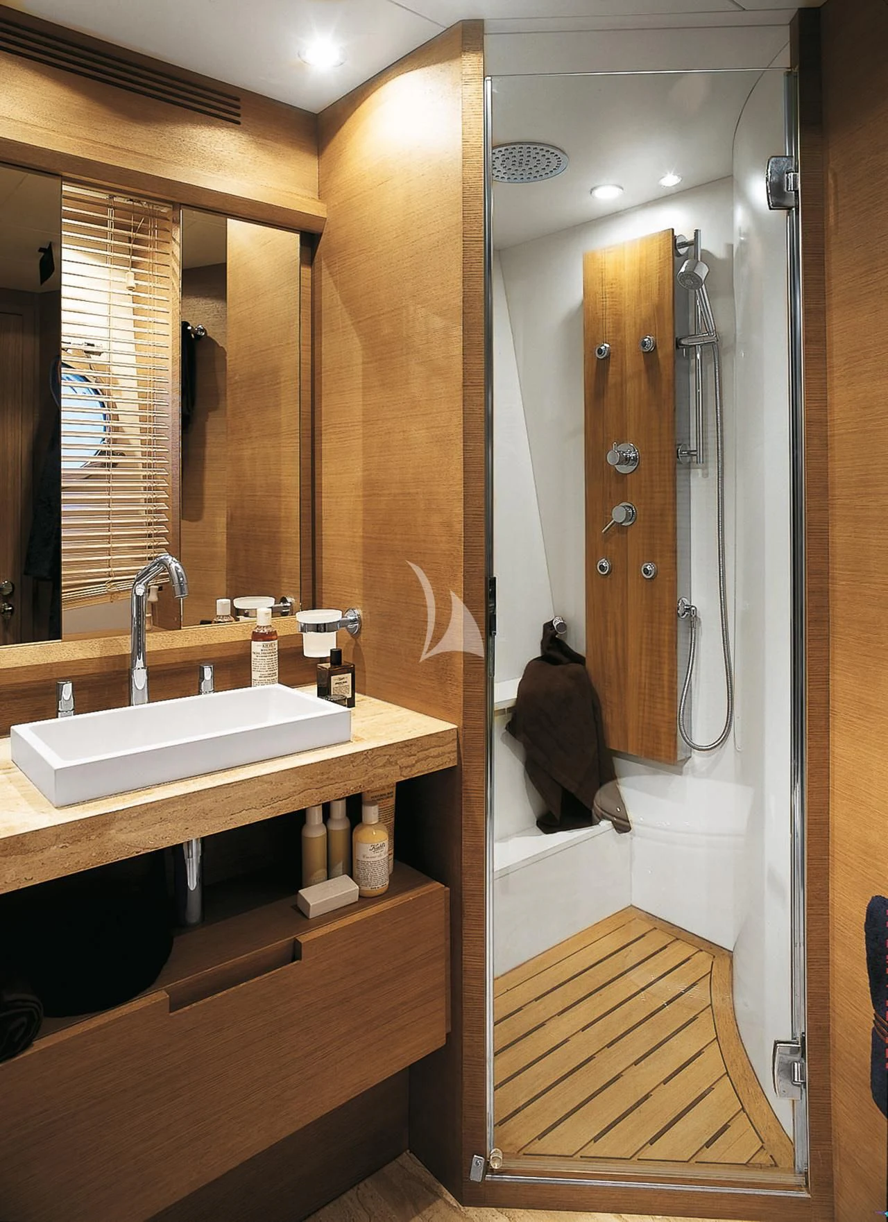 a bathroom with a large mirror aboard LEONARDO 98 Yacht for Sale