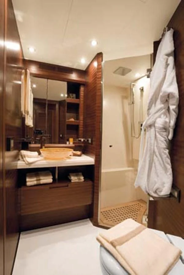 a bathroom with a large mirror aboard LEONARDO 98 Yacht for Sale