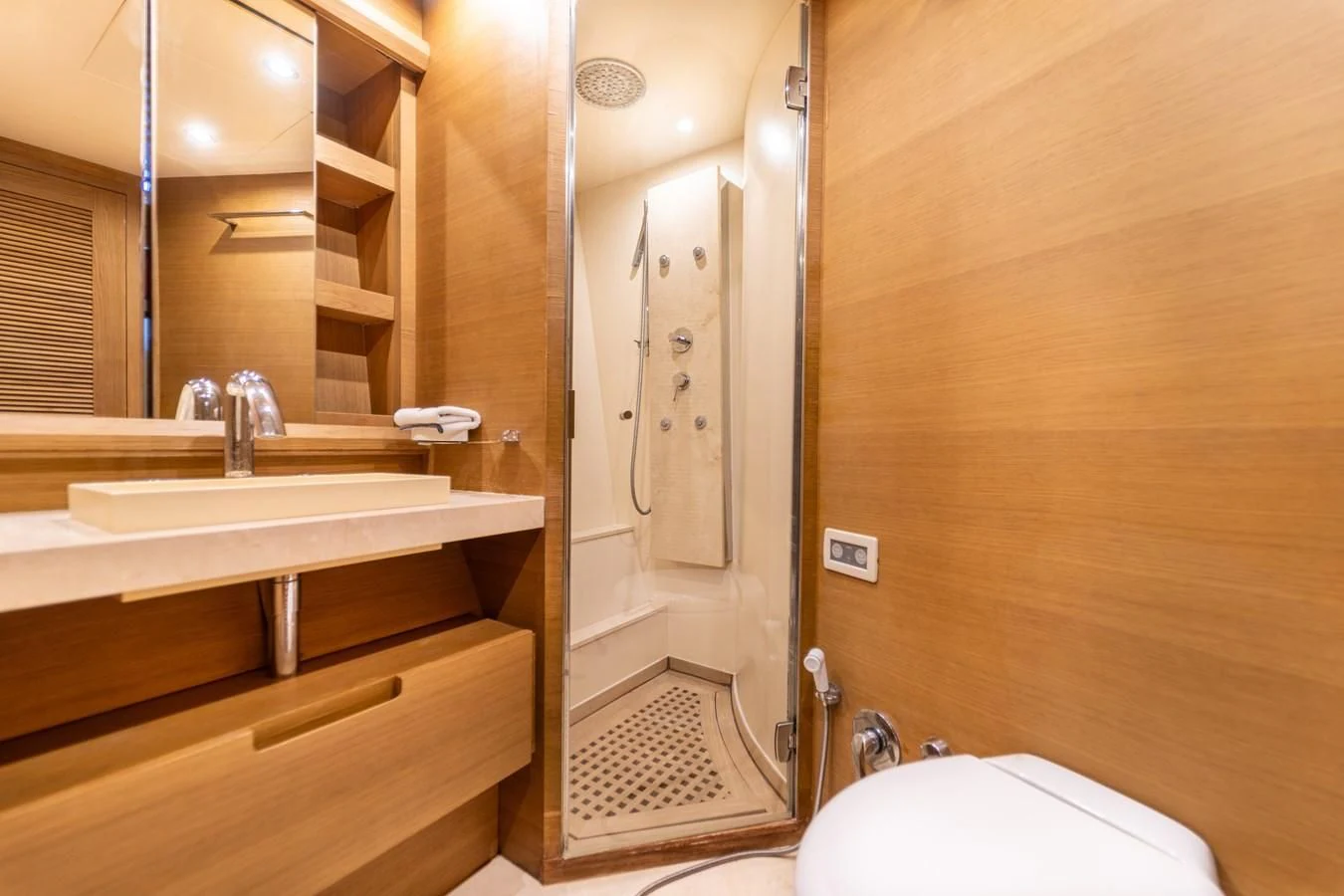 a bathroom with a sink and a mirror aboard LEONARDO 98 Yacht for Sale