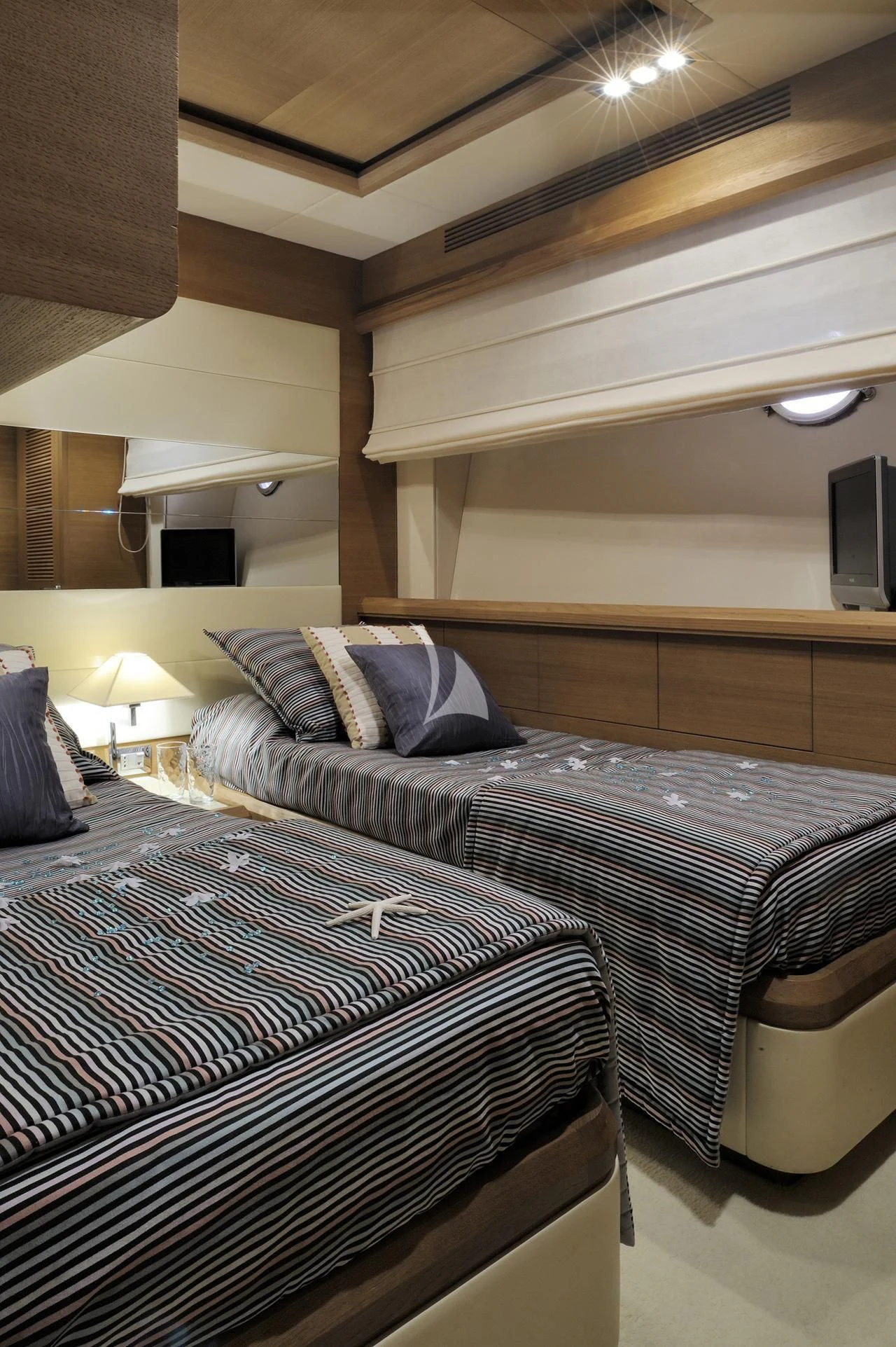 a couple of beds in a hotel room aboard LEONARDO 98 Yacht for Sale