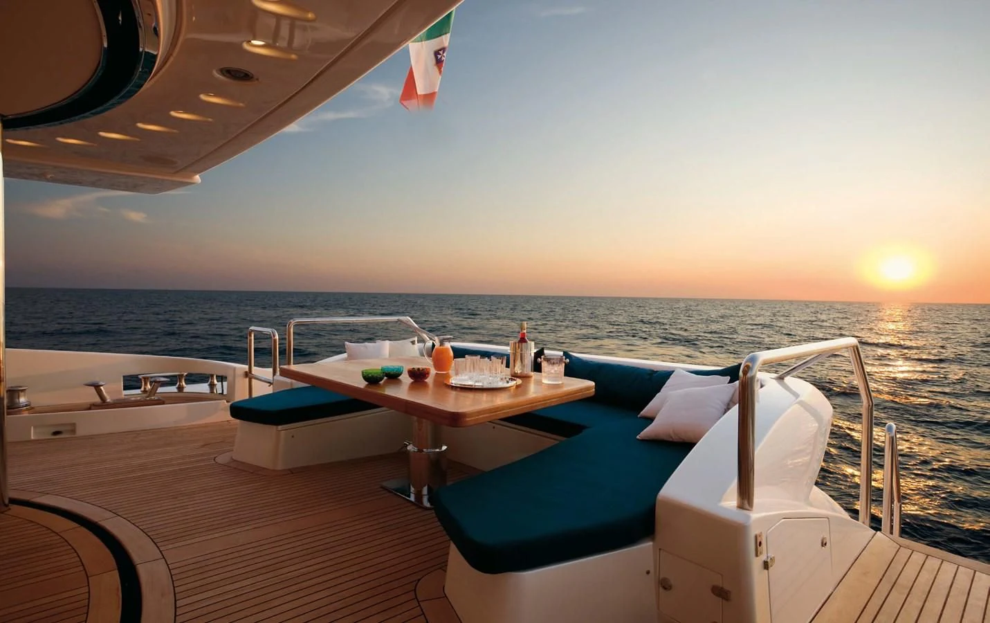 a lounge chair on a deck overlooking the ocean aboard LEONARDO 98 Yacht for Sale