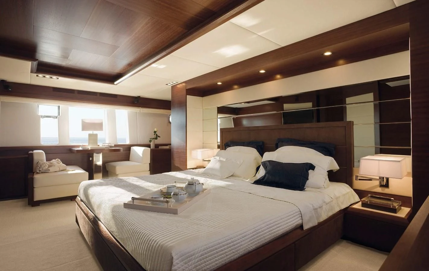 a large bedroom with a large bed aboard LEONARDO 98 Yacht for Sale