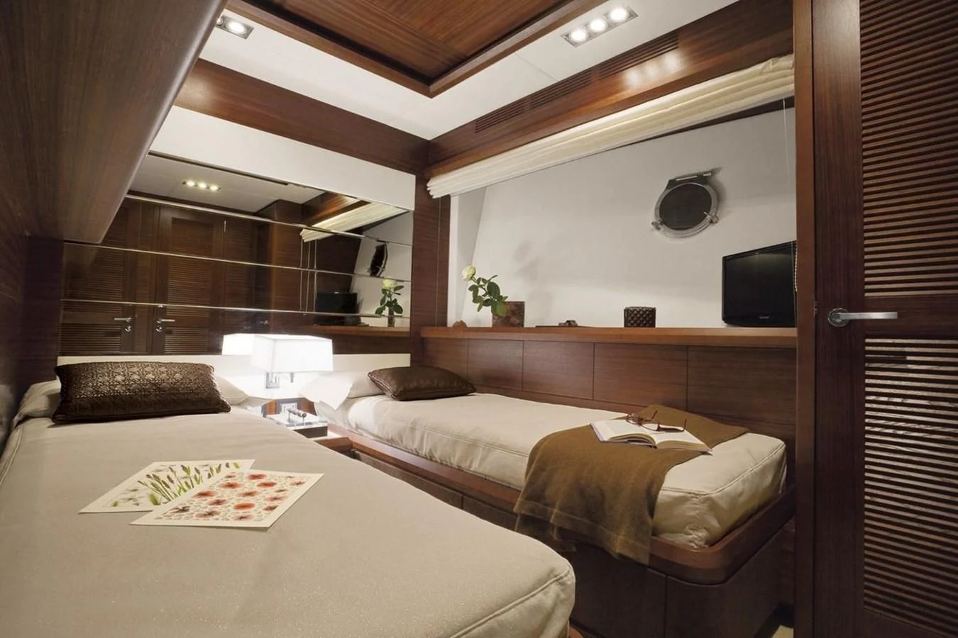 a room with two beds aboard LEONARDO 98 Yacht for Sale