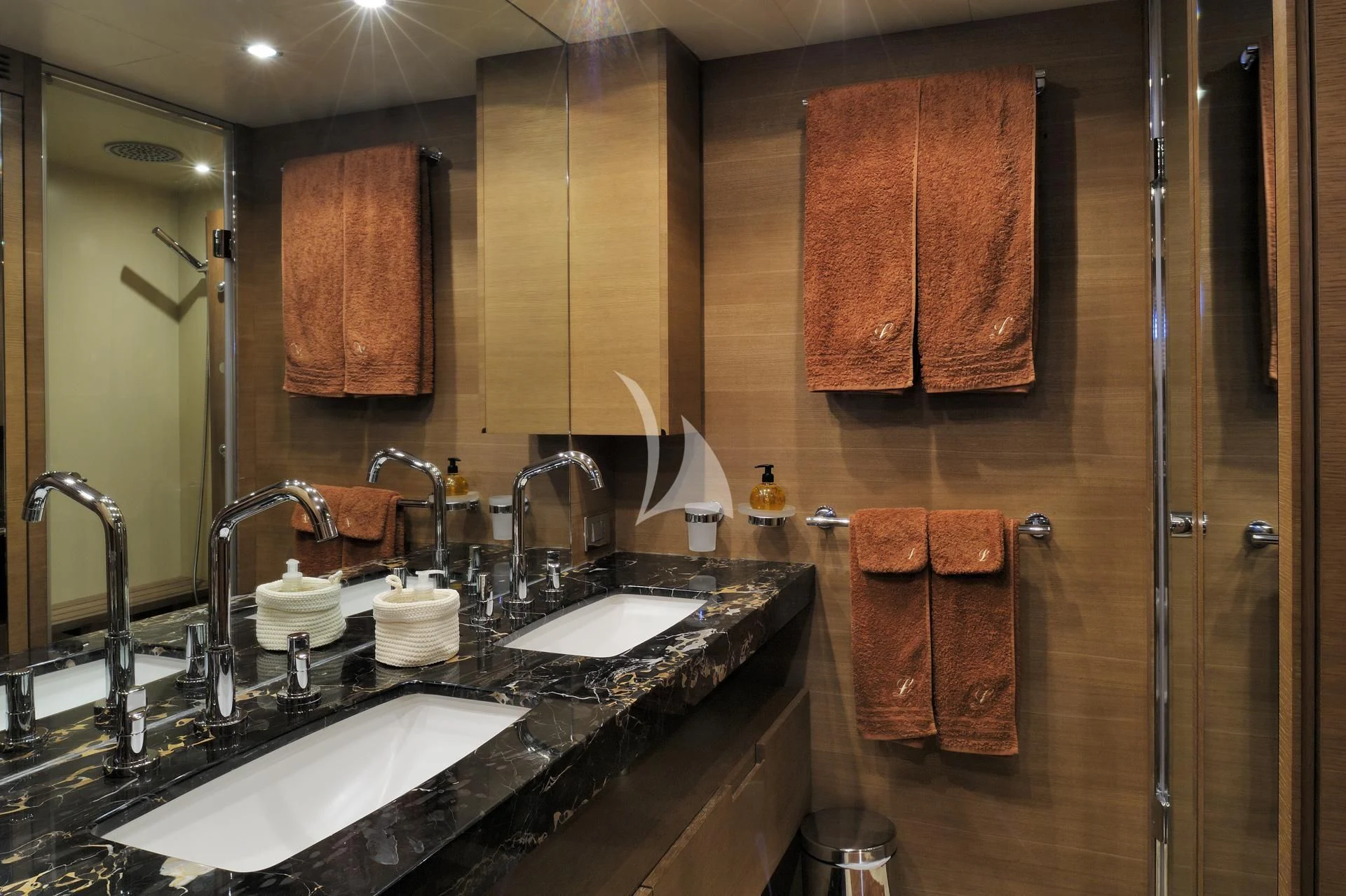 a bathroom with a large mirror aboard LEONARDO 98 Yacht for Sale