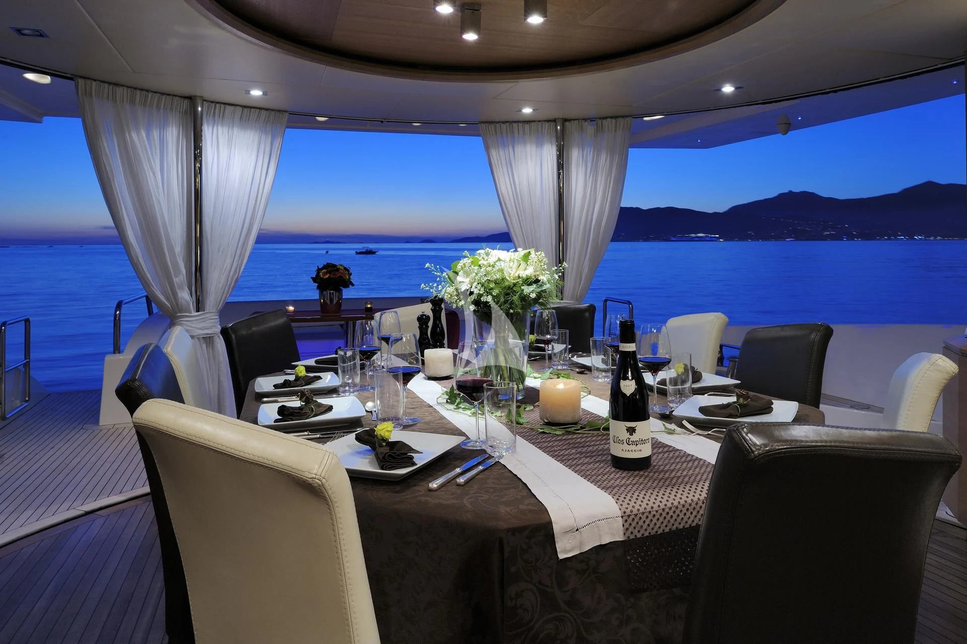 a table set for a dinner aboard LEONARDO 98 Yacht for Sale