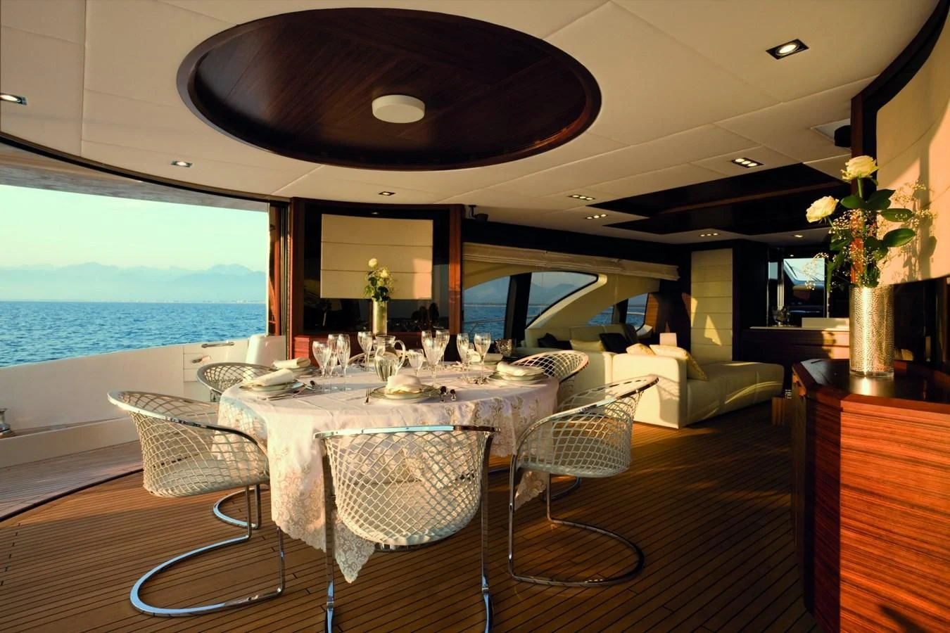 a dining room with a large window aboard LEONARDO 98 Yacht for Sale