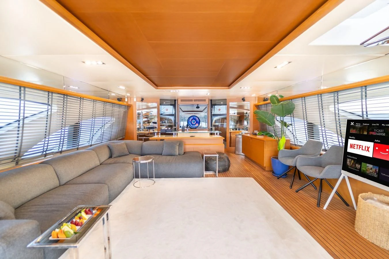 a living room with a large window aboard LEONARDO 98 Yacht for Sale