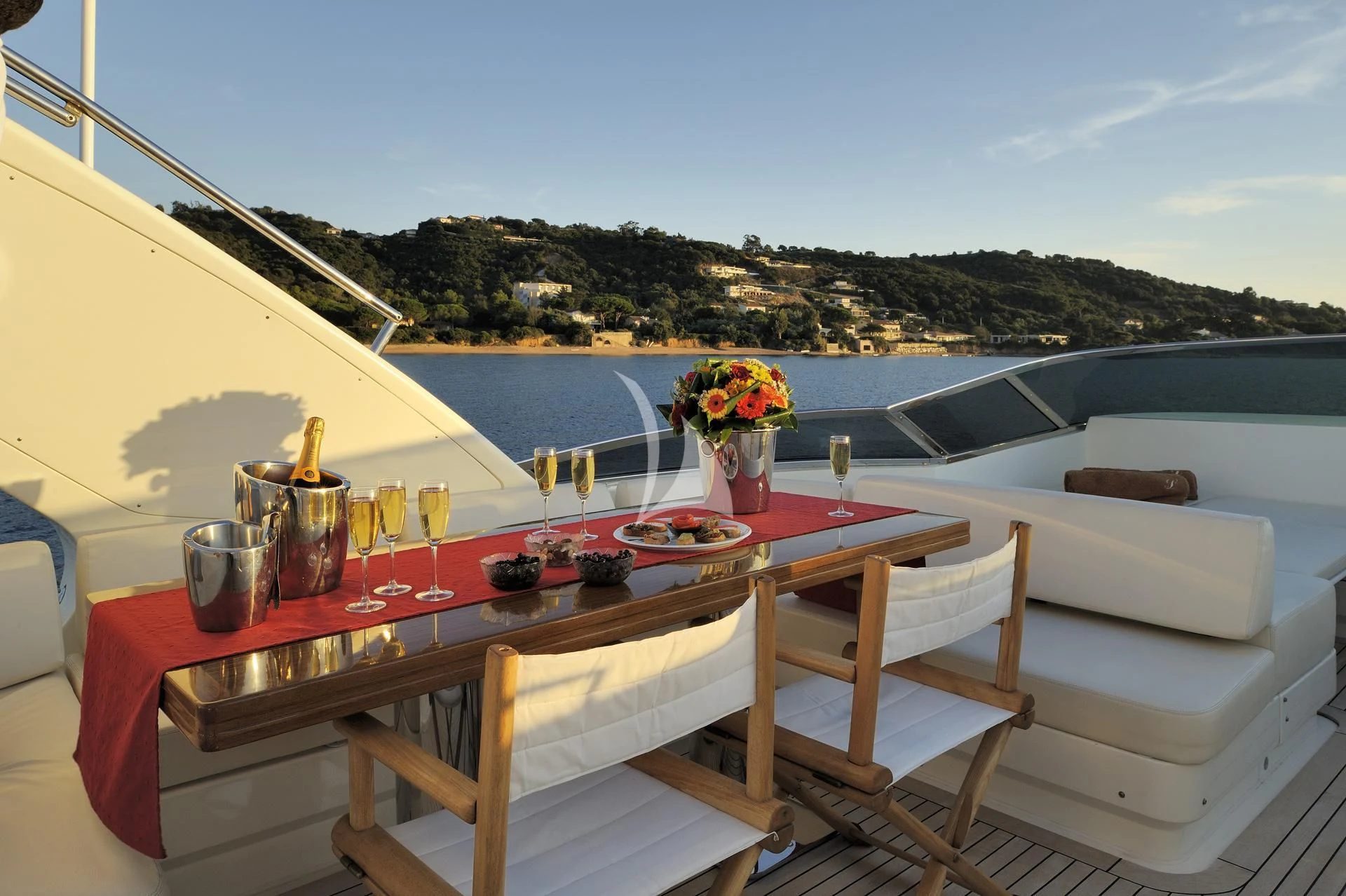 a table with food on it aboard LEONARDO 98 Yacht for Sale
