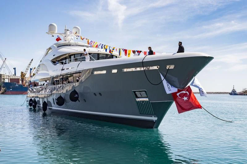 a boat with a flag on the front aboard LA PASSION Yacht for Sale