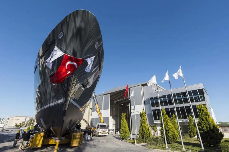 a flag flying in front of a building aboard LA PASSION Yacht for Sale