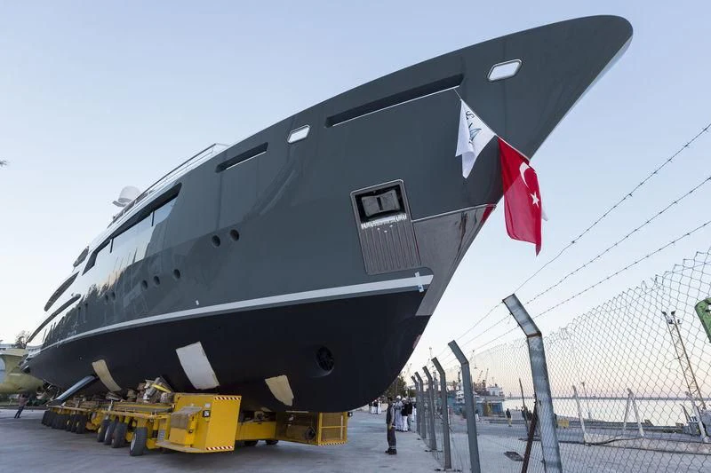 a large black helicopter with a red and white flag on it aboard LA PASSION Yacht for Sale