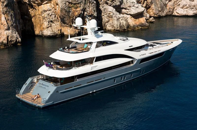 a white yacht on the water aboard LA PASSION Yacht for Sale