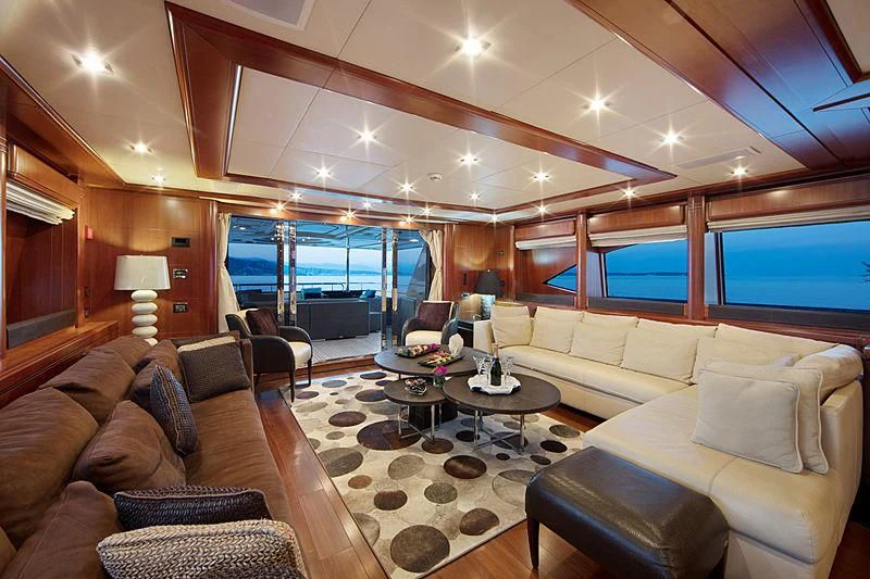 a living room with a large window aboard SIMA Yacht for Sale