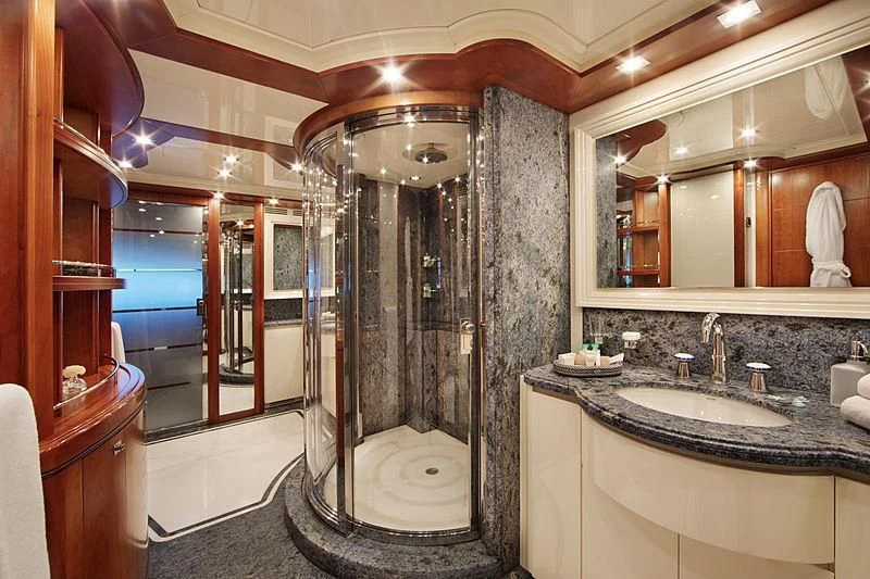 a bathroom with a glass shower aboard SIMA Yacht for Sale