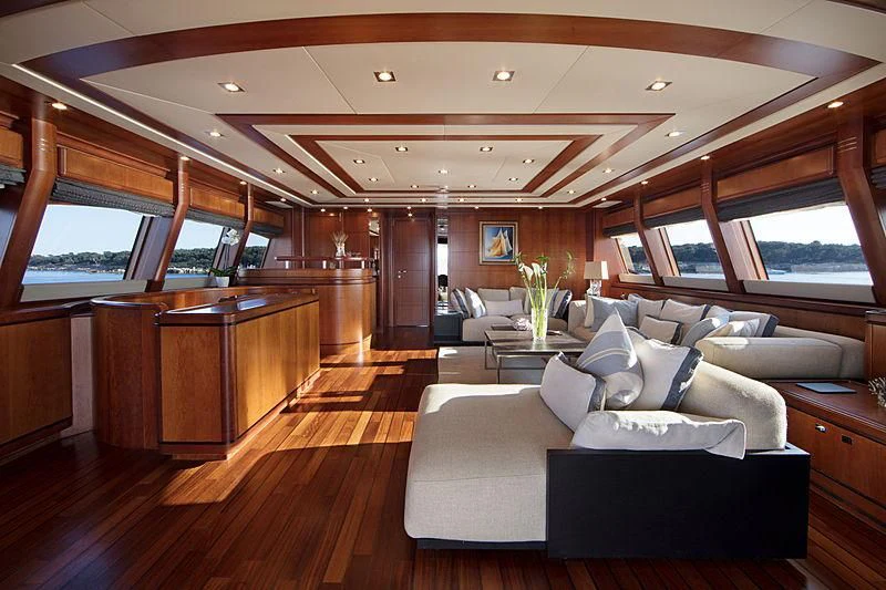a living room with a wood floor aboard SIMA Yacht for Sale