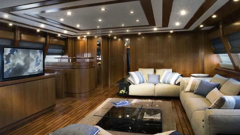 a living room with a large screen aboard SIMA Yacht for Sale